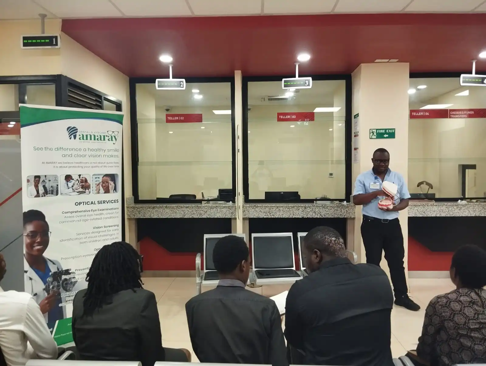 AMARAY team presenting to a bank about community dental and eye care services